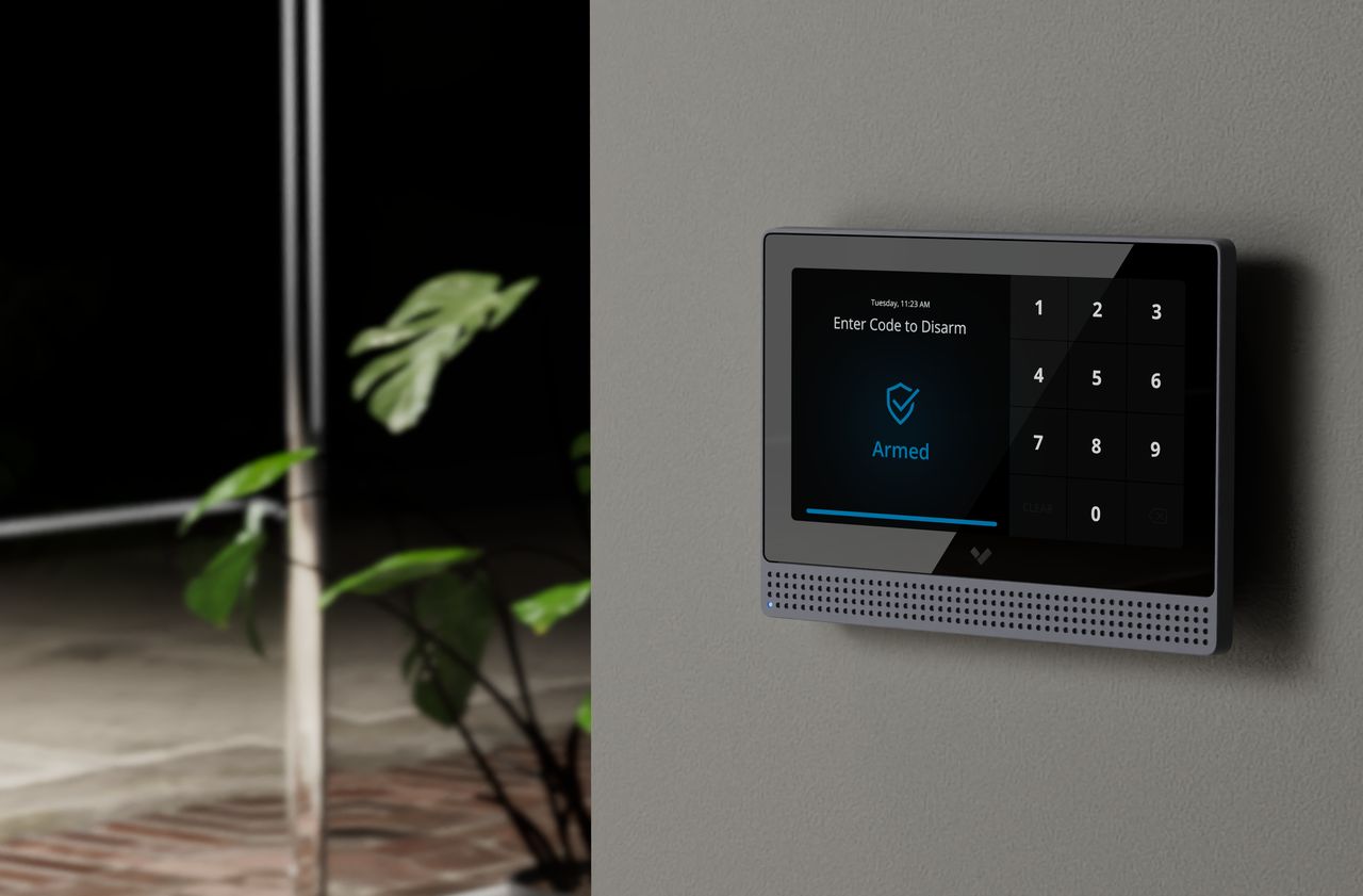 Verkada alarm panel mounted on a wall displaying Armed status with keypad.