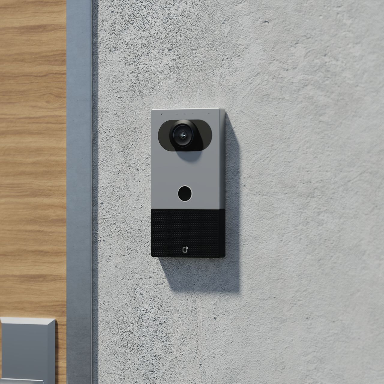Verkada video intercom doorbell mounted on a concrete exterior wall near a door.
