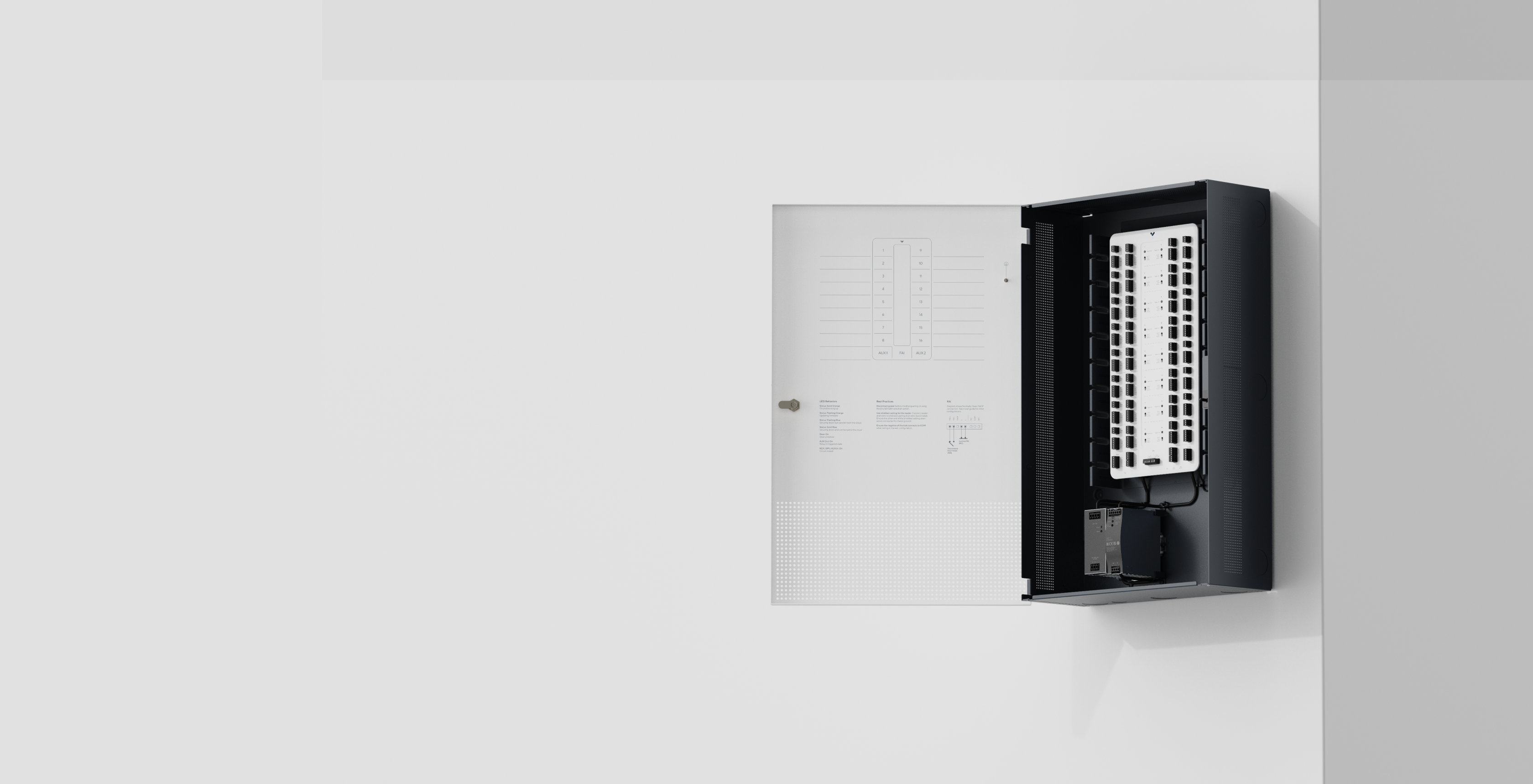 Verkada alarm control panel mounted on a wall with door open, showing internal components.