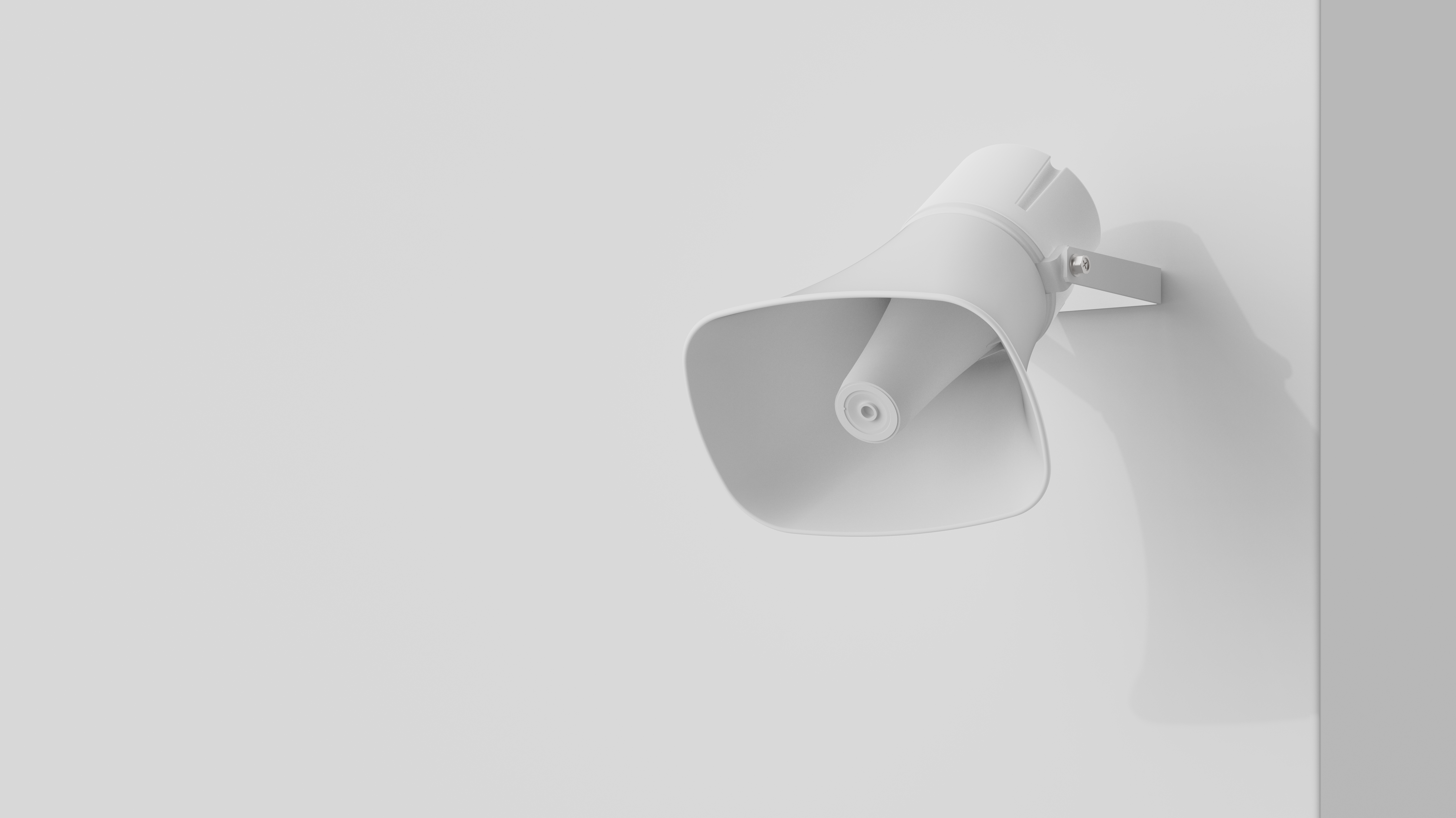 White Verkada horn speaker alarm mounted on a light grey wall.