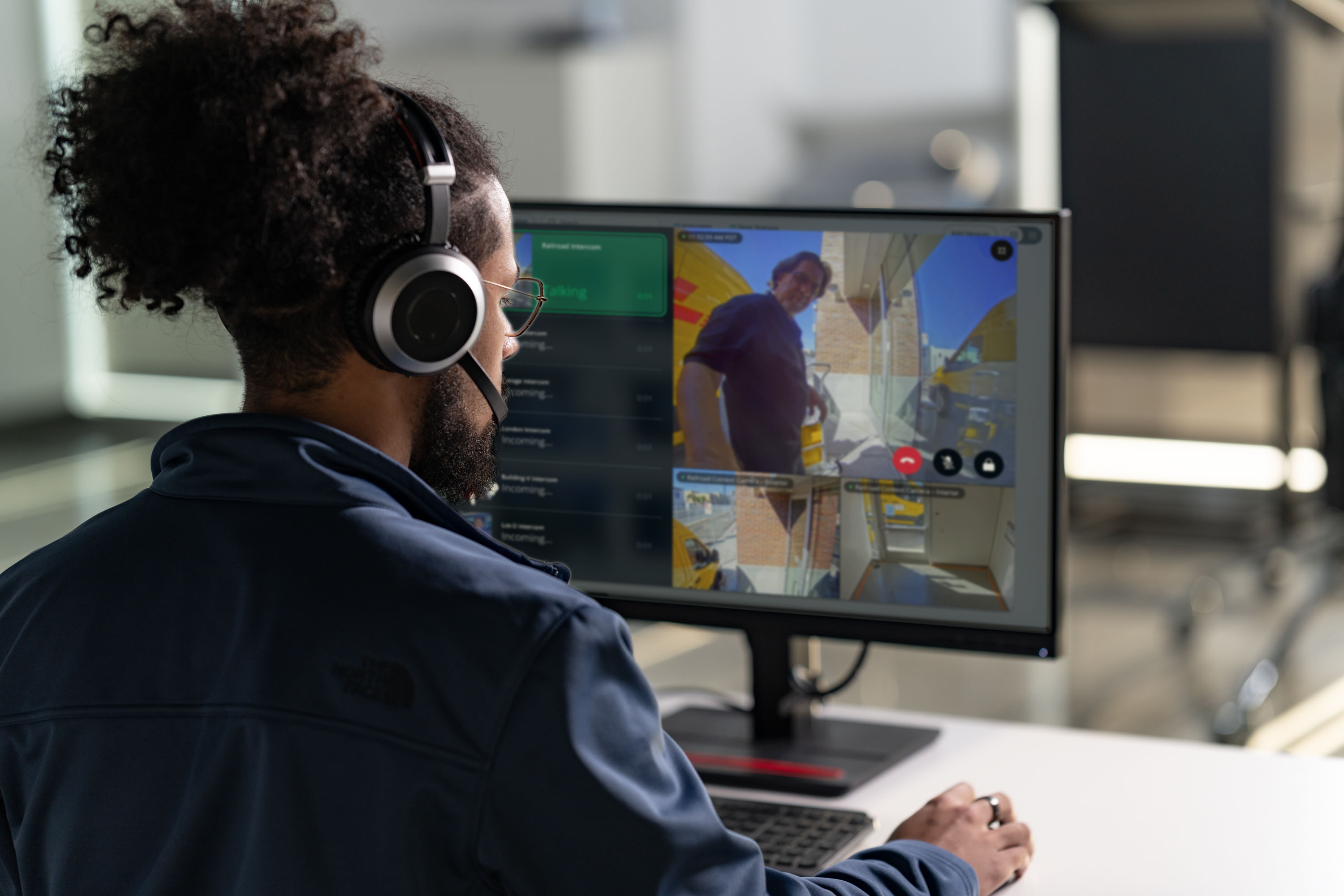 A call center agent monitors multiple concurrent Verkada Intercom video calls on a desktop screen.
